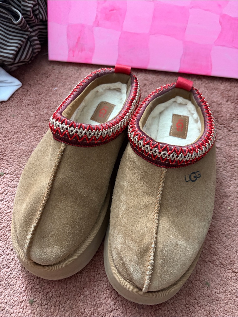 UGG Kids Slip-On Suede Slippers in Chestnut with Red Trim